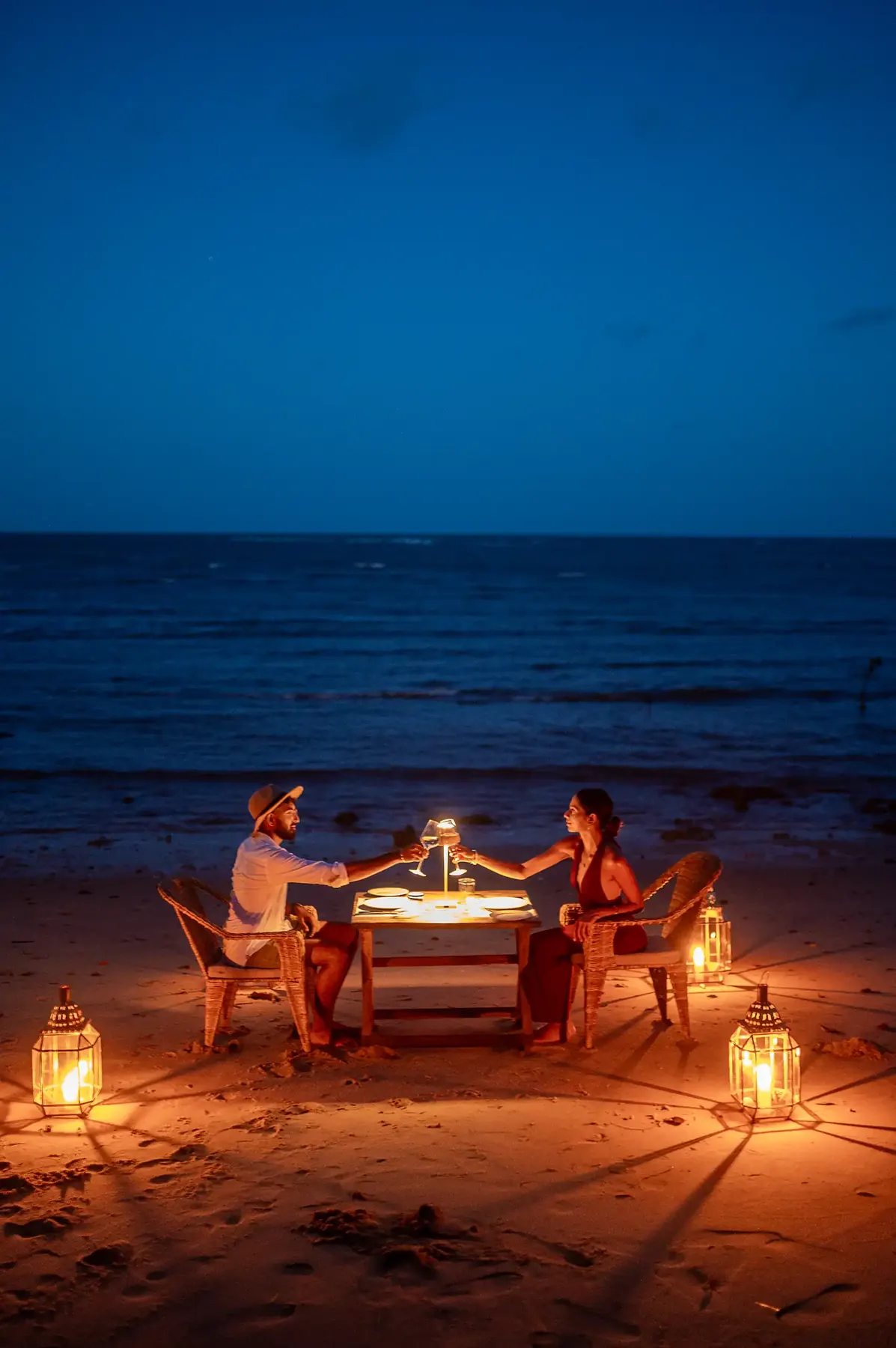 Private lantern-lit dinner on the beach