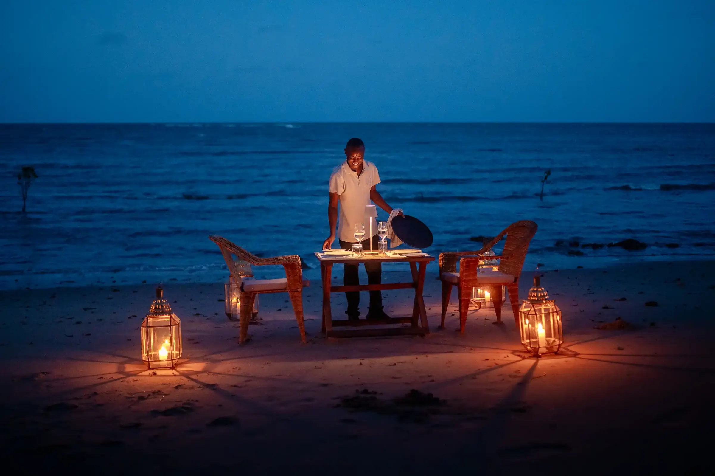 Beach dinner being set at dusk