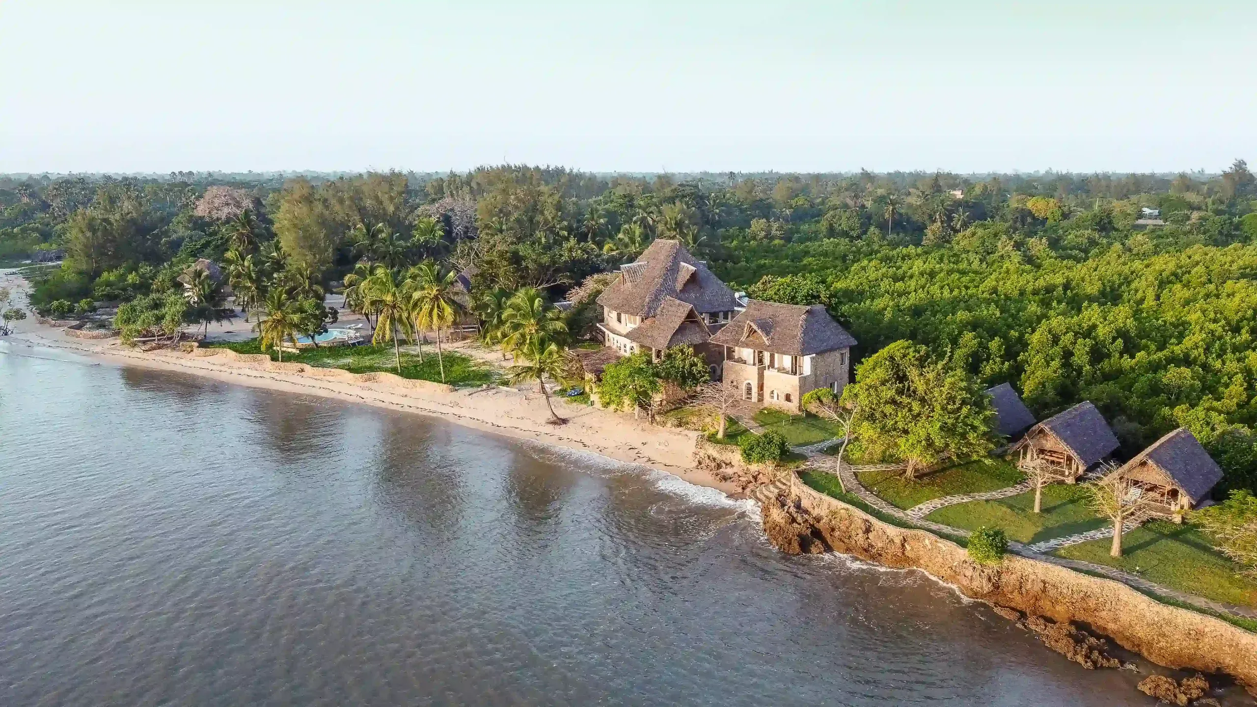 Aerial view of Mwazaro Beach Lodge between sea and mangroves