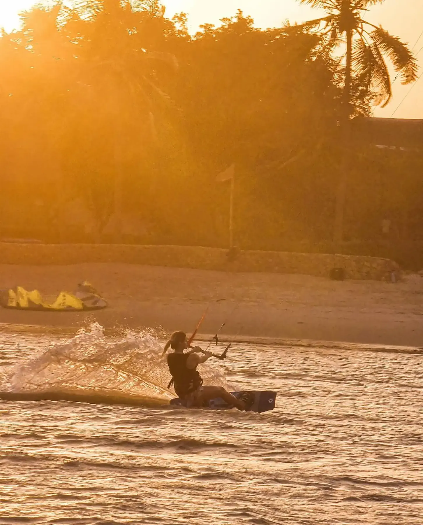 Kitesurfer riding at sunset in the Mwazaro lagoon