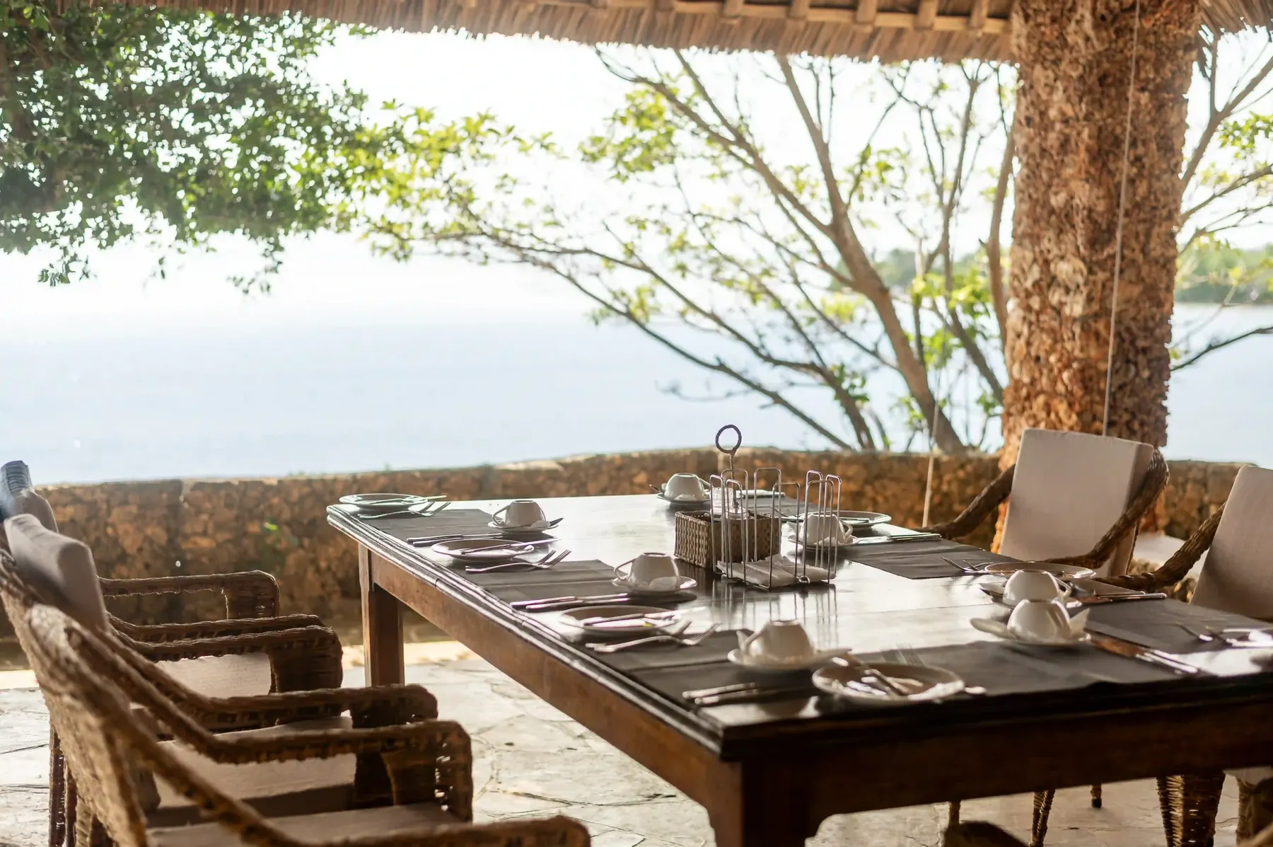 Restaurant table set on the coral cliff above the sea
