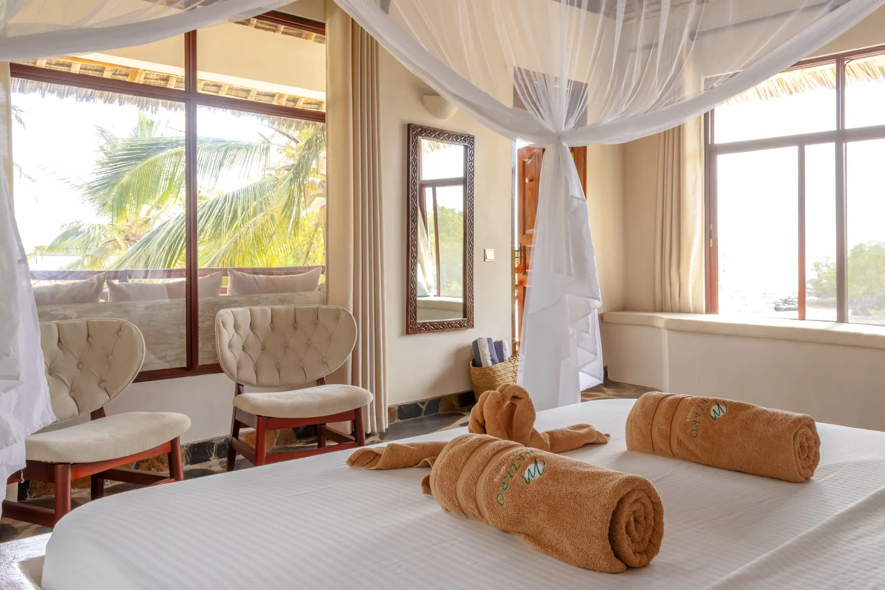 Beach Villa interior with seating area and palm views