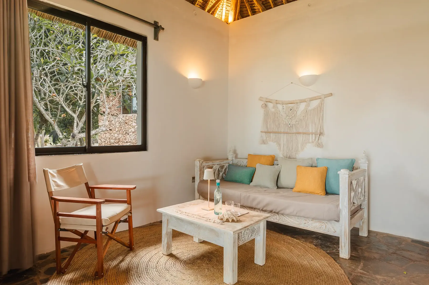 Deluxe room lounge under thatch
