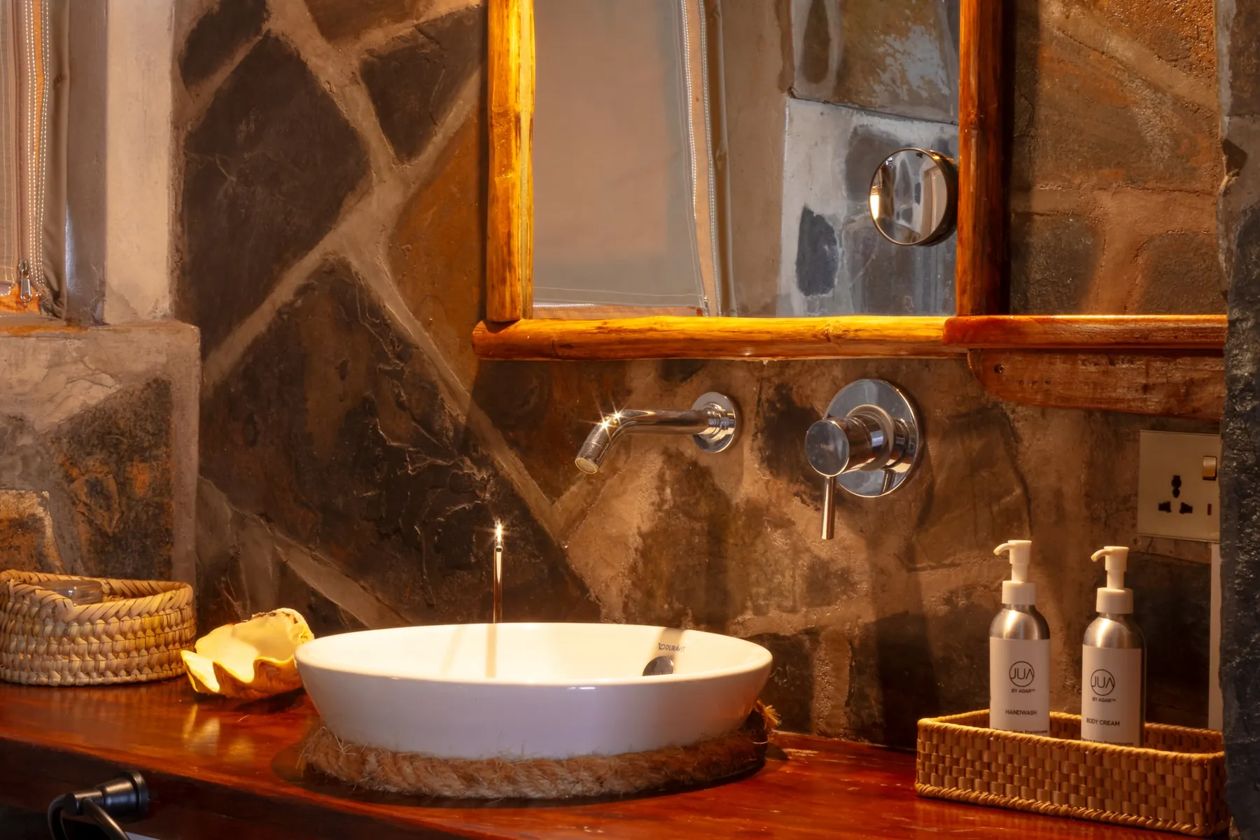 Stone-clad bathroom with round basin