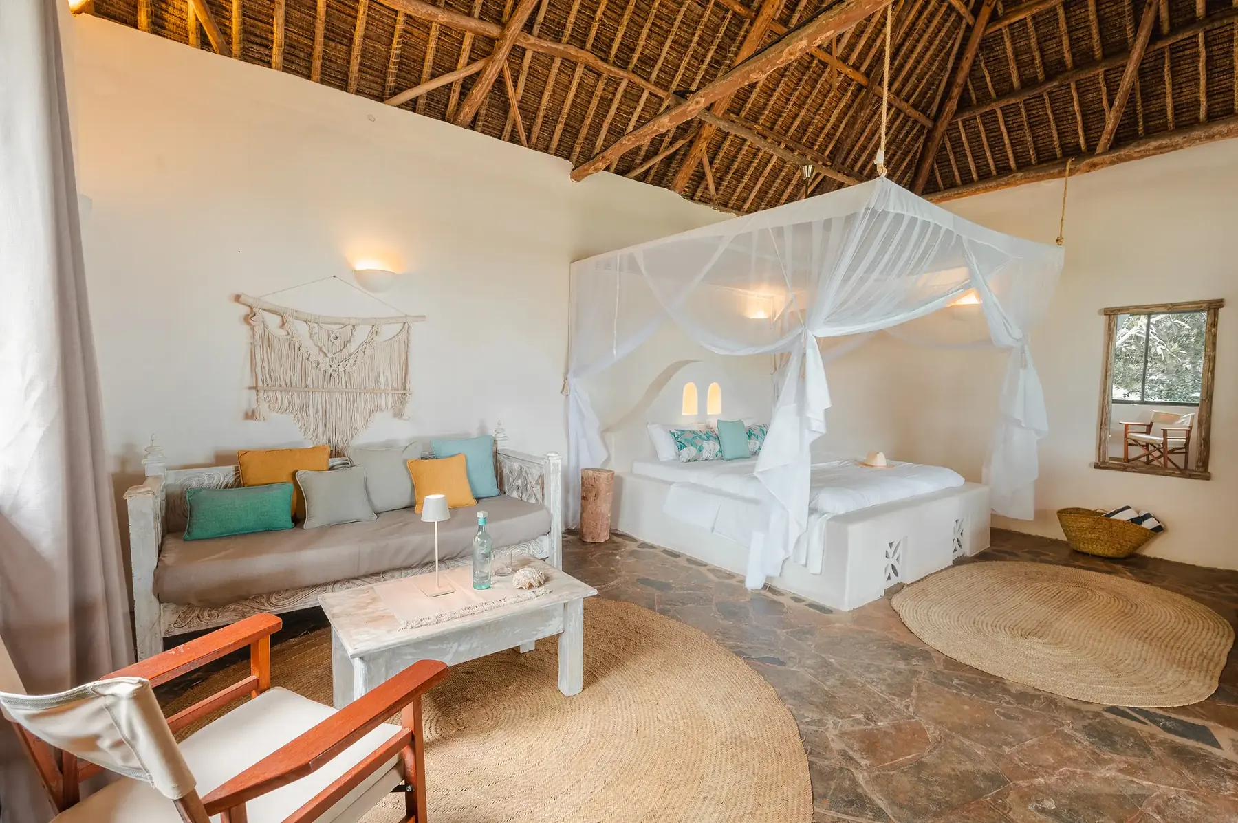 Four-poster bed in a bright suite