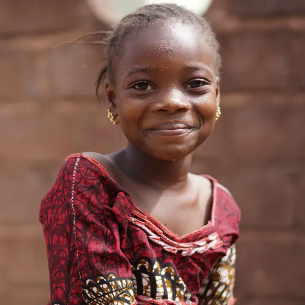 Pupil of the Kidimu School for the Deaf smiling