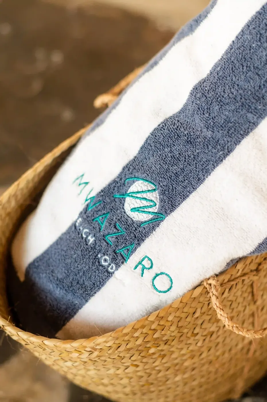 Mwazaro kikoi towel in a woven basket