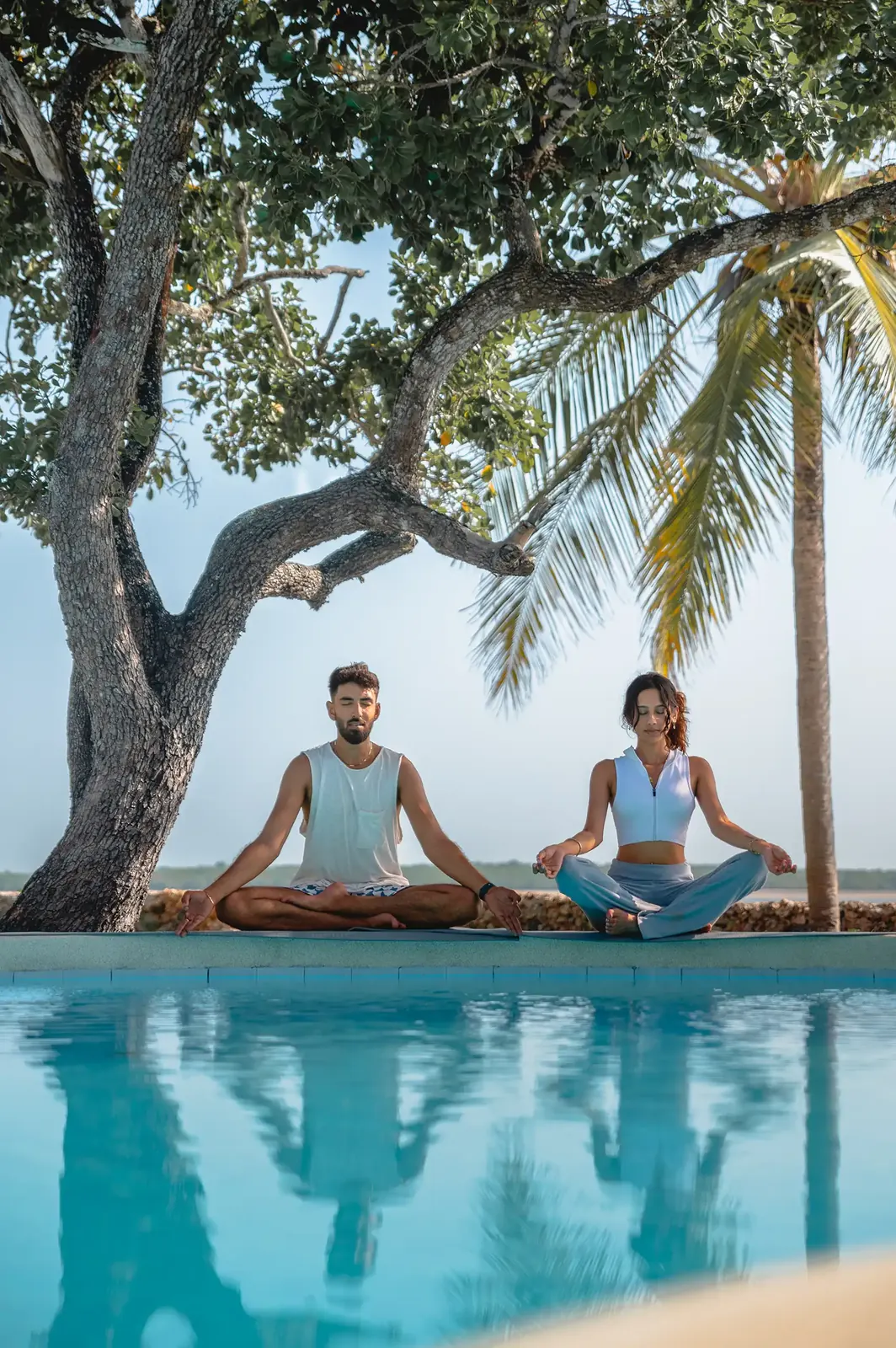 Yoga session beside the pool
